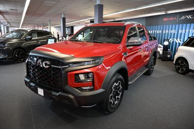 Double cab pickup with bold black mesh grille and LED headlights