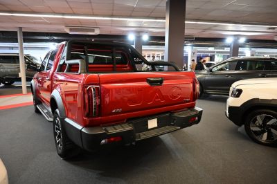Rear view of pickup with 4WD badge, roll bar, and distinctive tailgate
