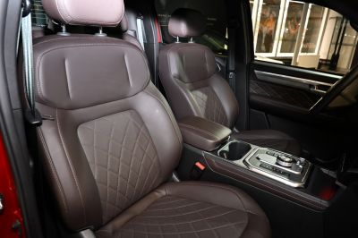Brown premium leather seats and modern center console with controls