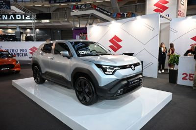 Front view of modern compact SUV with LED headlights and black rims