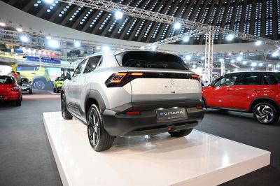 Rear view of modern SUV with sleek LED taillights and black cladding