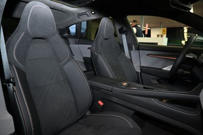 Front sporty seats with detailed stitching and modern car cabin