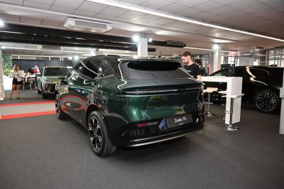 Sleek rear design with black roof and alloy wheels