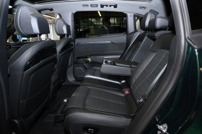 Rear seating with black leather upholstery and foldable armrest
