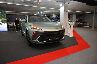 Front view with sharp LED daytime running lights and bold grille