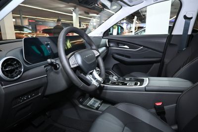 Digital dashboard and ergonomic steering wheel in car interior