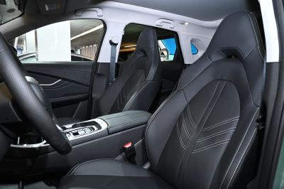Black leather front seats with detailed stitching