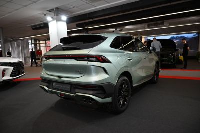 Rear and side view of modern SUV with dual exhaust and sleek tail lights