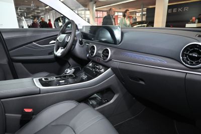 Modern dashboard with dual digital displays and circular air vents