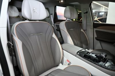 Luxurious perforated leather front seats and central console with cup holders