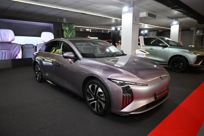 Sleek front view with aerodynamic shape and modern lighting of electric sedan