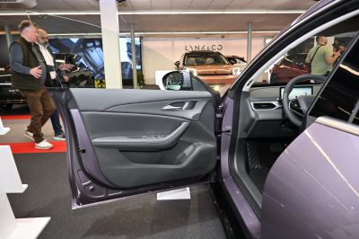 Open driver's side door interior with dashboard and steering wheel