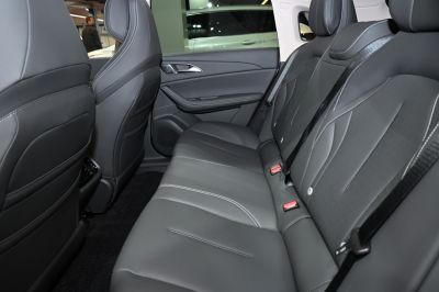 Rear seat with premium black leather upholstery and modern design.
