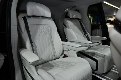 Premium white leather seats with armrests and detailed stitching