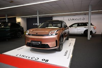 Front view of sleek electric SUV with LED headlights and aerodynamic styling