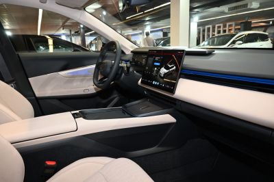 Minimalist car interior with central touchscreen and ambient lighting