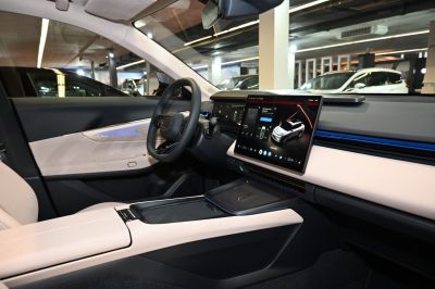 Modern car interior with digital dashboard and large touchscreen display