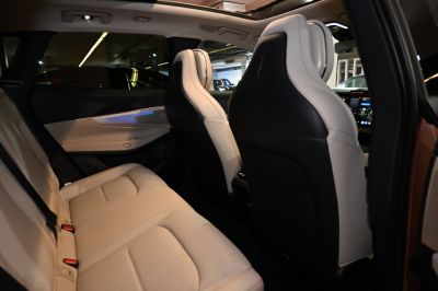 Beige rear seat with modern design and seat belts
