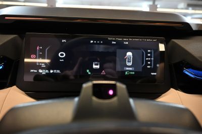 Digital instrument cluster with hybrid system display and vehicle status indicators