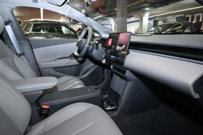Digital dashboard with touchscreen and minimalist interior design.