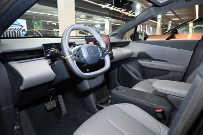 Distinctive square steering wheel with digital dashboard and modern center console