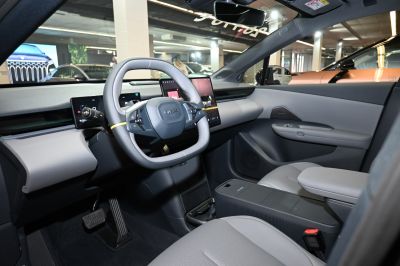 Rectangular steering wheel and multiple digital displays in car interior