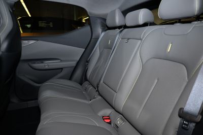Premium rear seat interior with grey upholstery and seatbelts