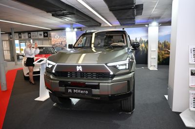 Angular LED daytime running lights and bold front grille of modern SUV