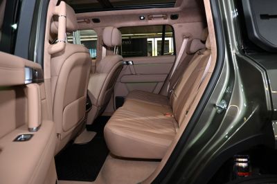 Premium tan leather rear seat with spacious cabin and advanced comfort features