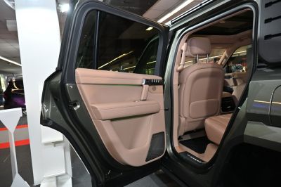 Luxury beige leather rear door with back seat interior.