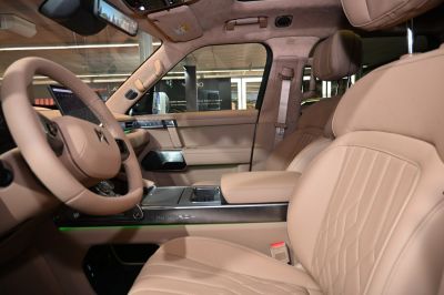 Luxurious beige leather interior with advanced dashboard and ergonomic seats