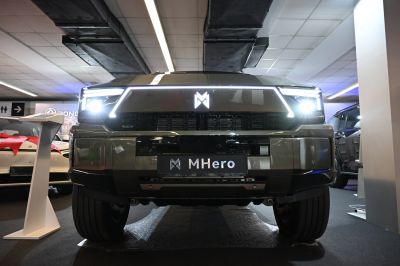 Front view with LED headlights and bold grille