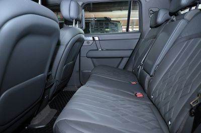 Spacious rear leather seats with modern car interior design features.