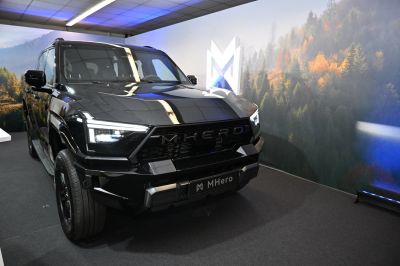 SUV front with sharp LED headlights and bold grille