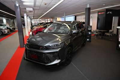 Front view of modern SUV with aggressive grille and sleek headlights