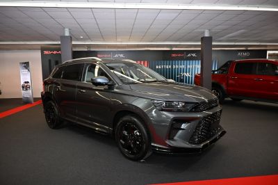 Sporty SUV with aggressive front grille and black alloy wheels
