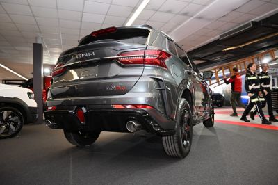 Rear view of an SUV with LED taillights and dual exhaust pipes