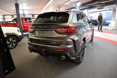 Rear view of SUV with dual exhausts and sporty design