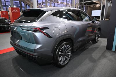 Rear and side view of a sleek SUV with distinctive taillights and alloy wheels