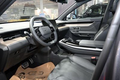 Modern digital dashboard and leather seats inside vehicle cabin