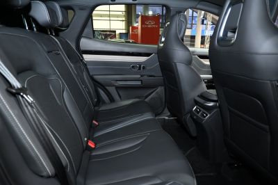 Spacious rear seats with leather upholstery and detailed stitching