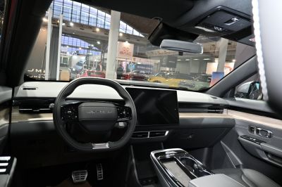 Steering wheel and digital dashboard with touchscreen display in car interior