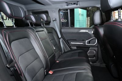 Black leather rear seats with red stitching and headrests