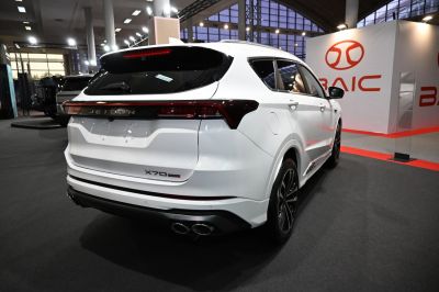 Rear LED taillights and quad exhaust tips on a modern SUV