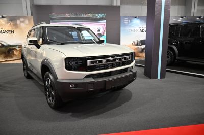 Bold front grille and rugged SUV exterior with modern headlights.