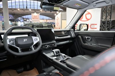 Modern interior with steering wheel and large central touchscreen