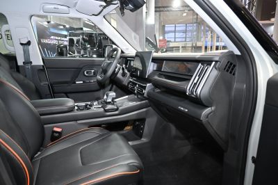 Modern car interior with digital display and leather seats
