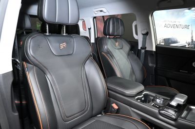 Leather seats with orange stitching and modern center console