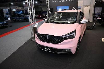 Compact EV with black honeycomb grille and sleek LED headlights