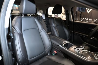 Black leather seats and modern center console with gear shifter